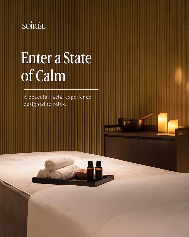 Soiree spa creative with a treatment bed, candles and the line Enter a State of Calm
